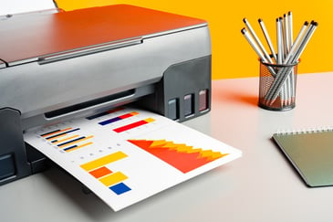 printer-with-trending-charts-printed-paper